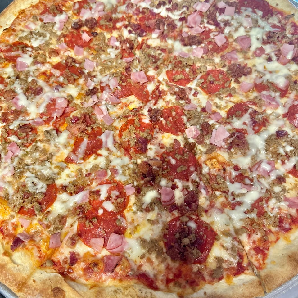 Indulge in Our Meat Pizza